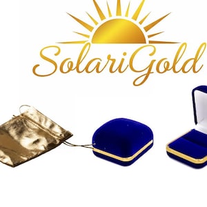 May include: The image displays a gold drawstring pouch, a closed blue velvet jewelry box with gold trim, and an open blue velvet jewelry box with gold trim. The logo "SolariGold" is at the top.