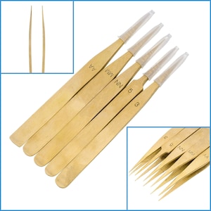 May include: Set of six gold-colored tweezers with clear plastic tips. The tweezers are labeled with numbers and letters, including "AA", "MM", "NN", "5", "3", and "9".