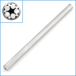 May include: A silver metal rod with a round, black and white patterned end.