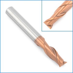 May include: A close-up of a brown and silver end mill with a 4-flute design. The end mill has a shank diameter of 0.500 inches and is marked with the text "0.500 Z1".