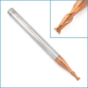 May include: A close-up of a gold-colored end mill with a silver shank. The end mill has a four-flute design and a 1/4 inch shank diameter.