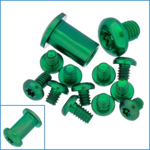 May include: A set of 12 green metal screws with a star-shaped head. The screws are various sizes and lengths.