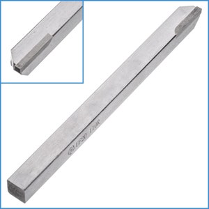 May include: A silver metal tool with a square base and a pointed tip. The tool is labelled "32 UF20 110R".