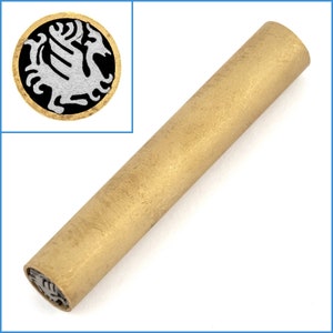 May include: A gold-colored metal pen with a silver-colored dragon design on the end.