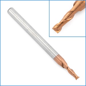 May include: A close-up of a silver and gold end mill with a 4 flute design. The end mill has a 1/4 inch shank and is 1/2 inch long. The end mill is made of high-speed steel and is designed for use in a variety of materials.