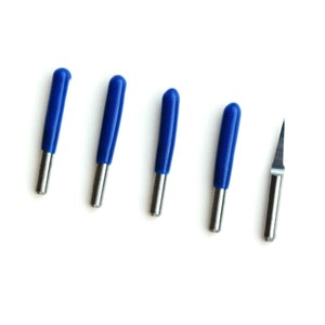 May include: Five blue and silver carving tools with a pointed tip. The tools are arranged in a row on a white background.