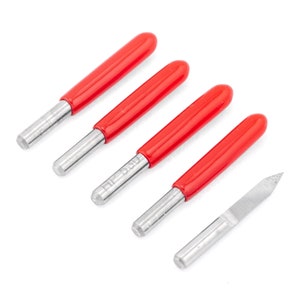 May include: Five router bits with red handles and a silver metal shaft, and a sixth silver metal router bit with a pointed tip.