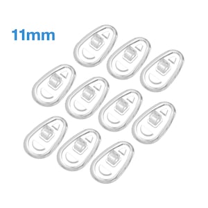 May include: Ten clear plastic 11mm eyeglass nose pads. The pads are shaped like a teardrop and have a small hole in the centre.