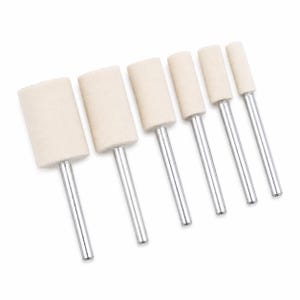 May include: Six buffing wheels with cylindrical, off-white felt heads and silver metal shafts. The wheels are arranged in a row, showcasing their varying sizes. Ideal for polishing and finishing applications.