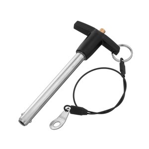 May include: A black and silver T-handle pin with a black cord and a metal ring. The pin is used to secure items together.