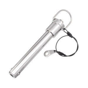May include: A silver metal clevis pin with a loop handle and a safety tether. The pin is designed for securing objects together.