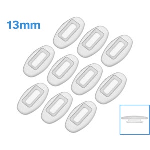 May include: Ten white oval-shaped adhesive pads with a smaller rectangular opening in the center. The pads are 13mm in size.