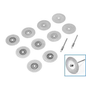 May include: A set of ten silver diamond-coated cutting discs for rotary tools, with two silver mandrels. The discs are arranged in a staggered pattern on a white background.