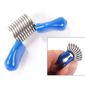 May include: A blue and silver finger exerciser with a spring coil. The exerciser is designed to help strengthen finger muscles.