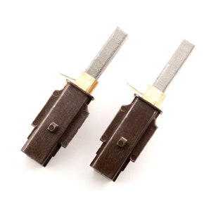 May include: Two brown carbon brushes with gold-colored connectors and gray carbon rods. The brushes are used in electric motors.
