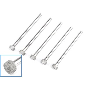May include: Set of six silver diamond-coated grinding bits with a rounded head. The bits are used for grinding and shaping various materials.