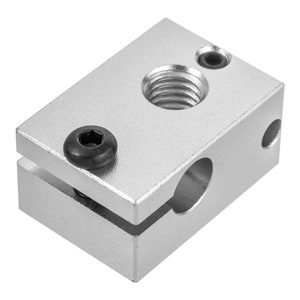 May include: Silver metal 3D printer part with a round hole and two screw holes. The part has a black screw in one of the holes.