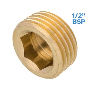 Könnte beinhalten: Ein 1/2 Zoll BSP-Gewindeverschluss aus Messing mit sechseckigem Kopf.