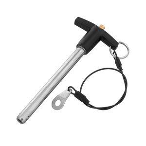 May include: A silver and black spring-loaded pin with a T-shaped handle and a black cord with a loop at the end.