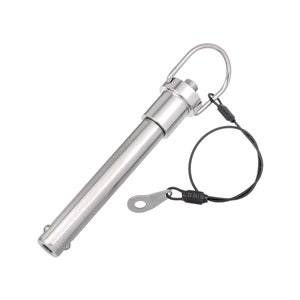 May include: A silver metal clevis pin with a loop on one end and a safety wire attached to the loop. The pin is about 6 inches long.