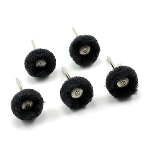 May include: Five black sanding wheels with metal shafts. The wheels are attached to the shafts with a metal ring.