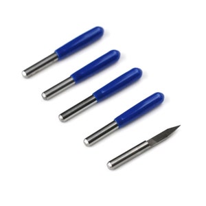 May include: Five router bits with blue handles and a single, pointed cutting edge. One bit is shown without the handle.