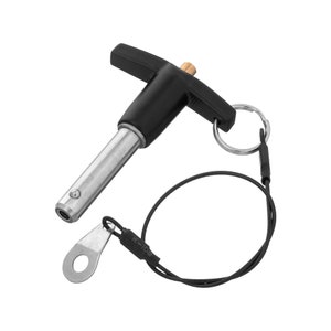 May include: A black T-handle pin with a silver metal pin and a black cord with a metal ring and a black tag that says "K-102".