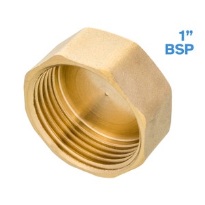May include: A 1-inch brass pipe cap with a hexagonal shape and a threaded opening. The cap is designed to seal the end of a pipe.