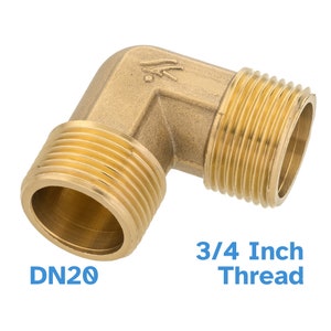 May include: A brass 3/4 inch threaded elbow fitting. The fitting is designed for connecting pipes or hoses. The fitting is labelled "DN20".