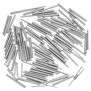 May include: A large quantity of silver metal dowel pins scattered on a white background. The dowel pins are various lengths and diameters.