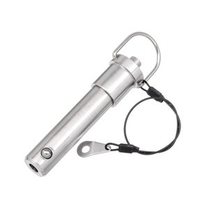 May include: A shiny, stainless steel quick release pin with a ring handle and a black wire lanyard. The pin has a cylindrical body with a ball bearing and a small, flat metal tag attached to the lanyard.