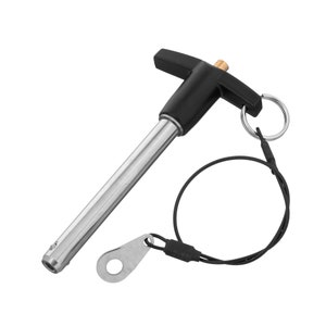 May include: A black and silver T-handle pin with a black cord and a silver ring. The pin is used for securing items.