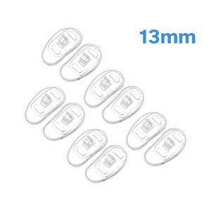 May include: Eight pairs of clear plastic 13mm eyeglass nose pads. The pads have a rectangular shape with a small, clear plastic insert in the center.