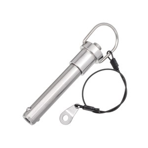 May include: A stainless steel quick release pin with a ring handle and a black wire lanyard. The pin has a cylindrical body and a small button on the end. The lanyard has a metal tag attached.