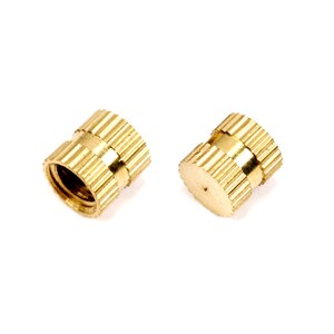 May include: Two gold-colored threaded inserts with a knurled outer surface. The inserts are designed for use in plastic or wood.