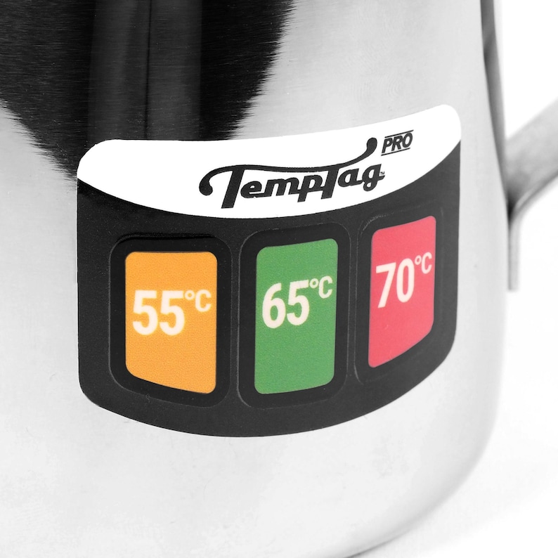 May include: Stainless steel milk frothing pitcher with a black TempTag PRO label. The label has three temperature indicators: 55&deg;C, 65&deg;C, and 70&deg;C.