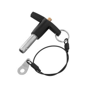 May include: A black and silver spring-loaded pin with a T-shaped handle and a tethered loop. The pin is designed for quick release and has a safety feature to prevent accidental release.