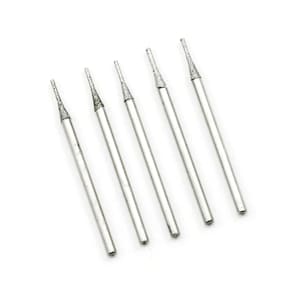 May include: Six silver diamond tipped drill bits for use in a rotary tool.