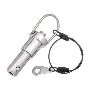 May include: A silver metal quick release pin with a loop and a black cord attached. The cord has a black plastic end cap with the text "125" printed on it.