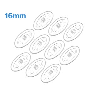 May include: Ten clear, oval-shaped adhesive pads, each with a small square in the center. The pads are 16mm in diameter.