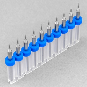 May include: A set of ten drill bits with blue and silver tips, organized in a clear plastic case with a blue trim.
