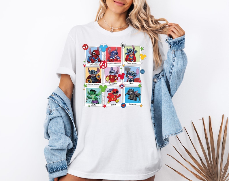 a woman wearing a white t - shirt with a picture of various characters on it