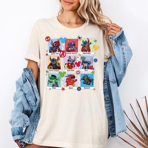 a woman wearing a t - shirt that has pictures of cartoon characters on it