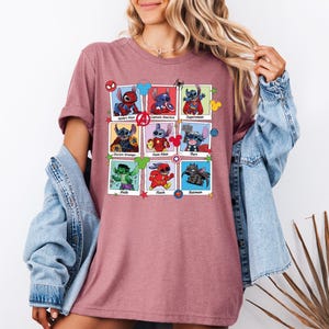 a woman wearing a t - shirt with images of cartoon characters on it