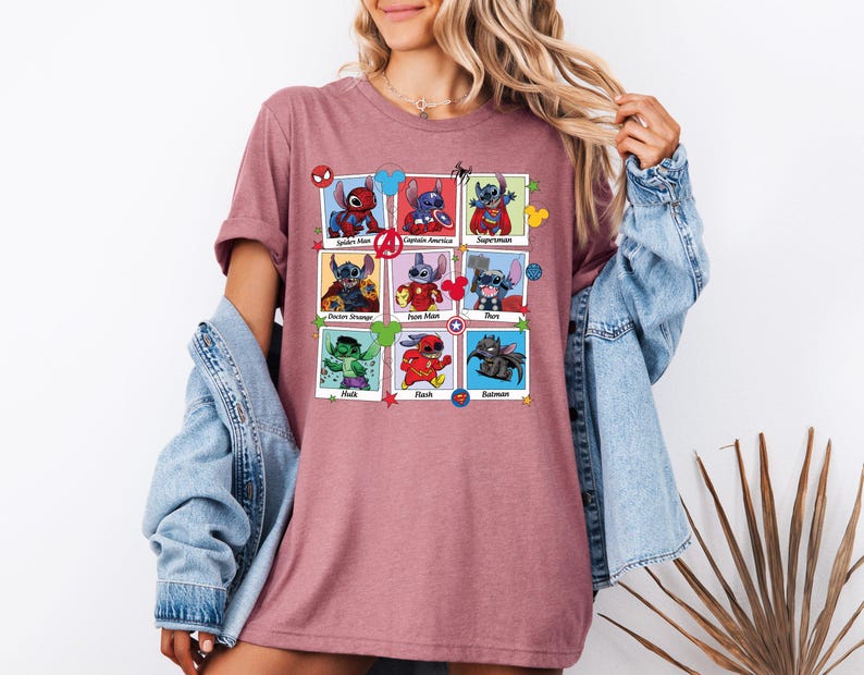 a woman wearing a t - shirt with images of cartoon characters on it
