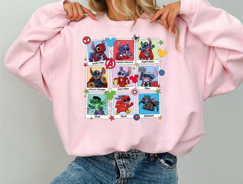 a woman wearing a pink sweatshirt with cartoon characters on it