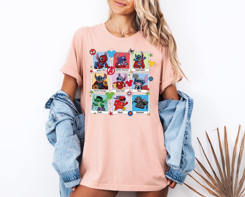 a woman wearing a pink t - shirt with pictures of cartoon characters on it