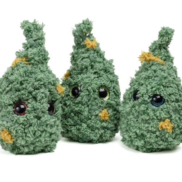 May include: Three plush green Christmas tree ornaments with googly eyes and yellow accents.