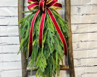 Christmas Faux Greenery Swag with Red Velvet Bow.