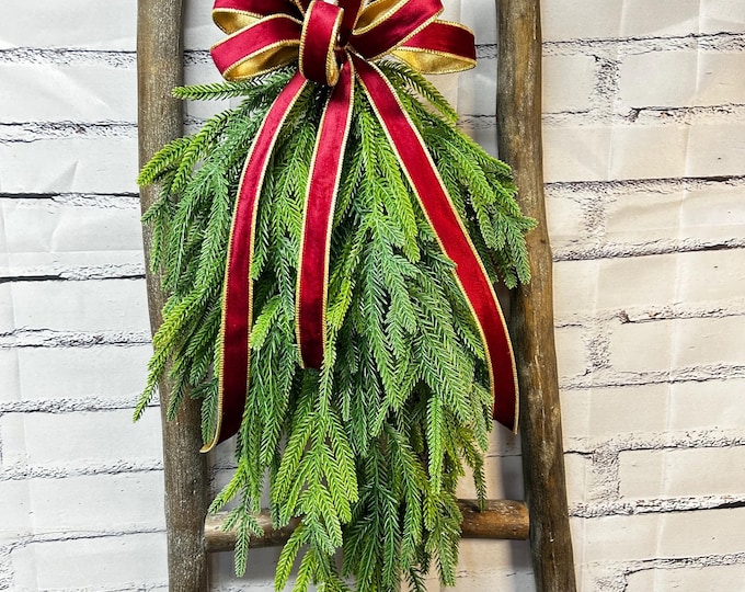Christmas Faux Greenery Swag with Red Velvet Bow.